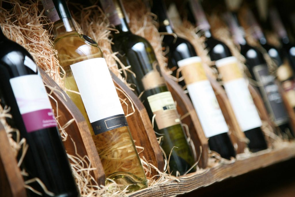 Cartons of wine bottles getting packed for professional wine transportation